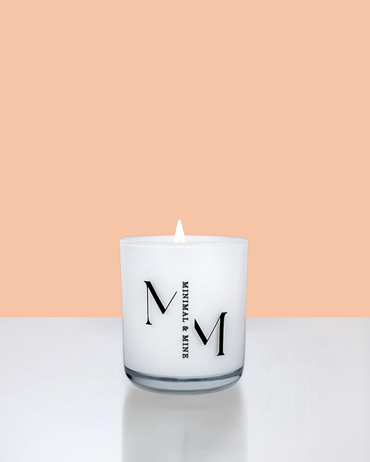Peaches Candle Jar in sleek white glass, hand poured with natural soy wax and lit, showcasing vibrant summer vibes.